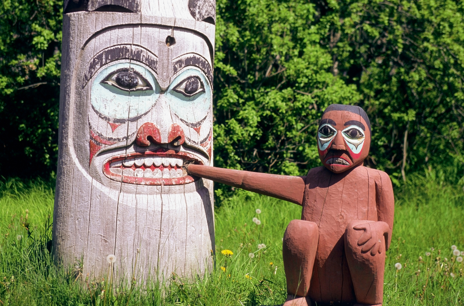 Close-up of Totem Pole and a figure, Ketchikan, Alaska, USA