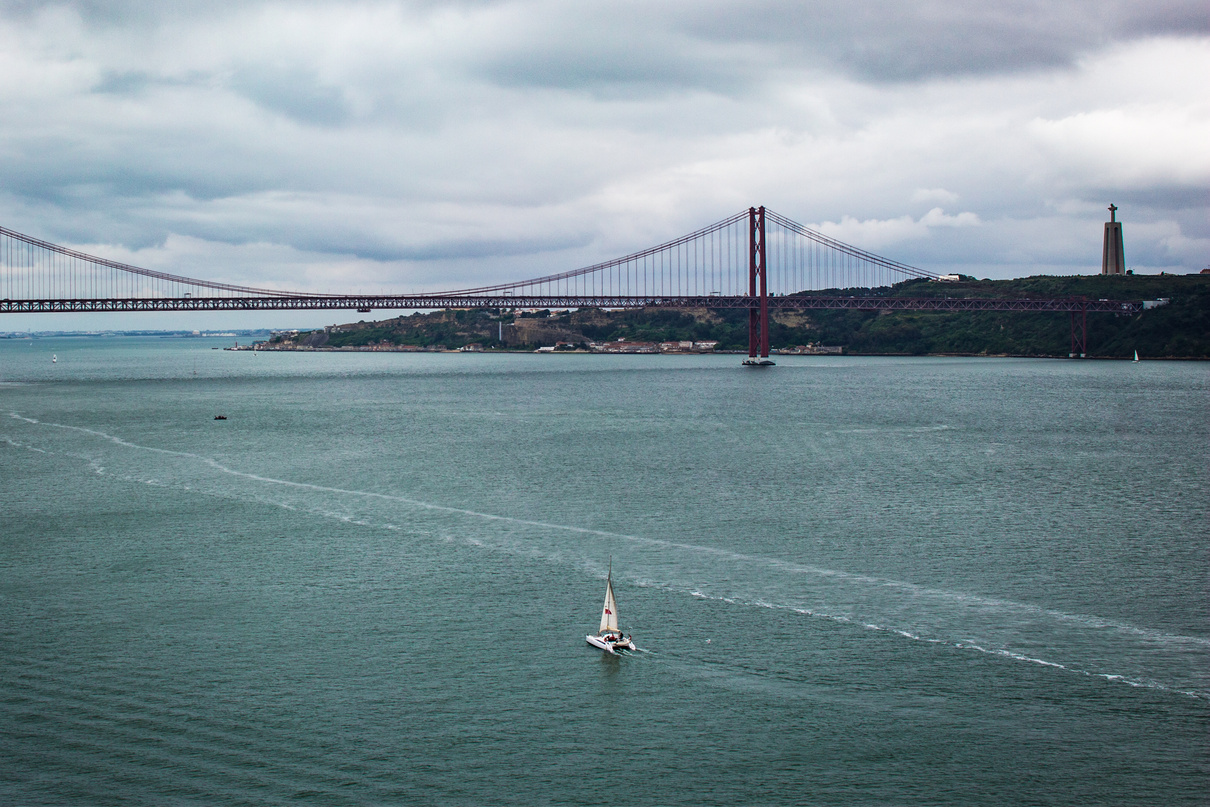 Lisbon river Tagus, sail boat and bridge, Lisbon, Portugal