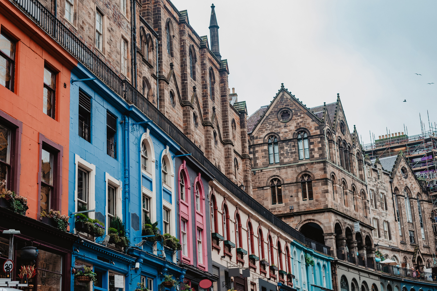 Colorful shop fronts on the famous Victoria Street in Edinburgh's Old Town